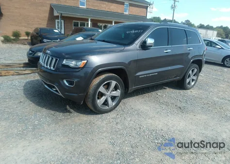 2014 Jeep Grand Cherokee Overland z USA, uszkodzony, nr VIN 1C4RJFCG6EC570431